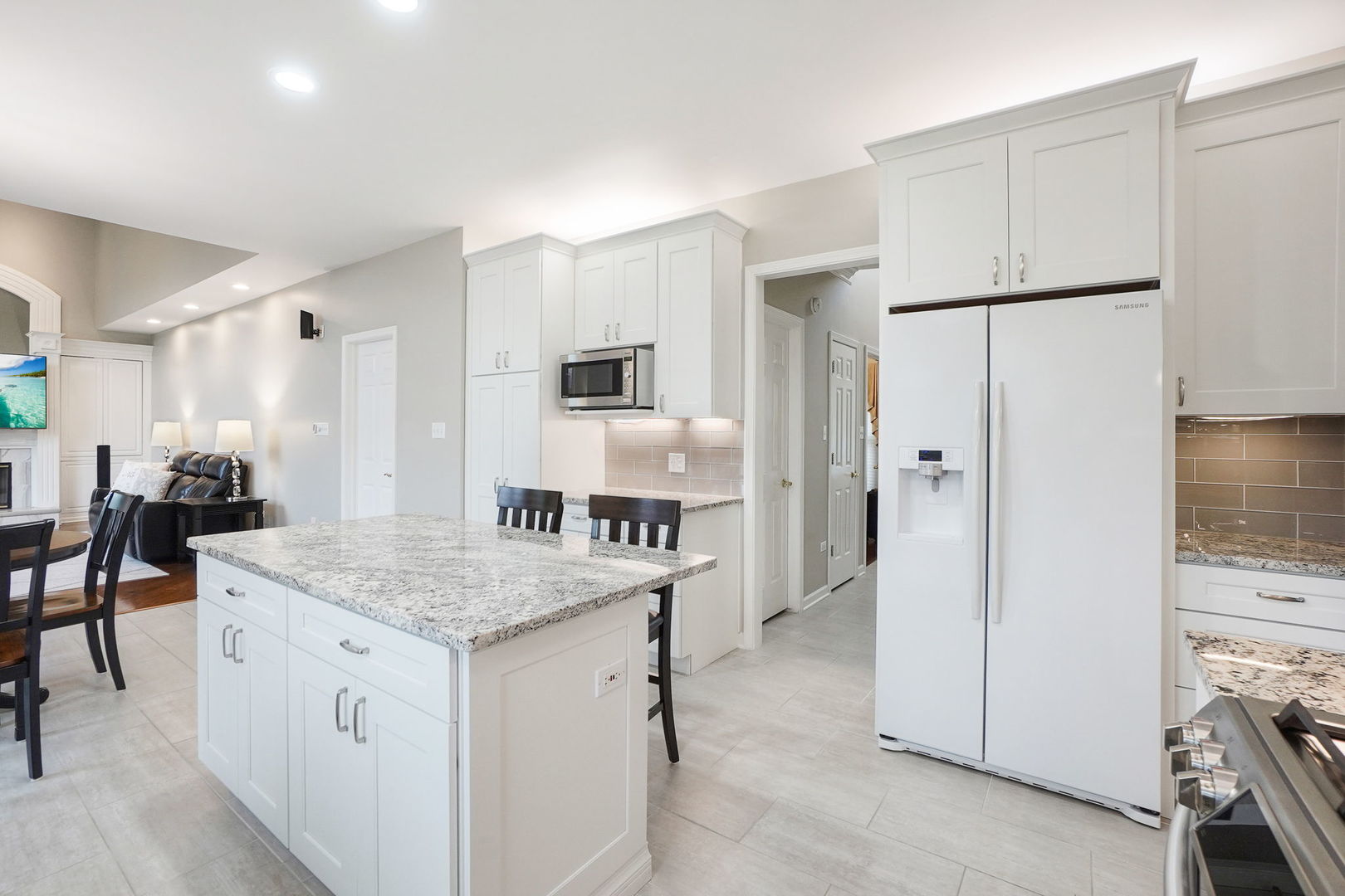 4775 Snapjack Circle Naperville, IL 60564 - Photo 19 of 55 a kitchen with a refrigerator a stove a sink a dining table and chairs