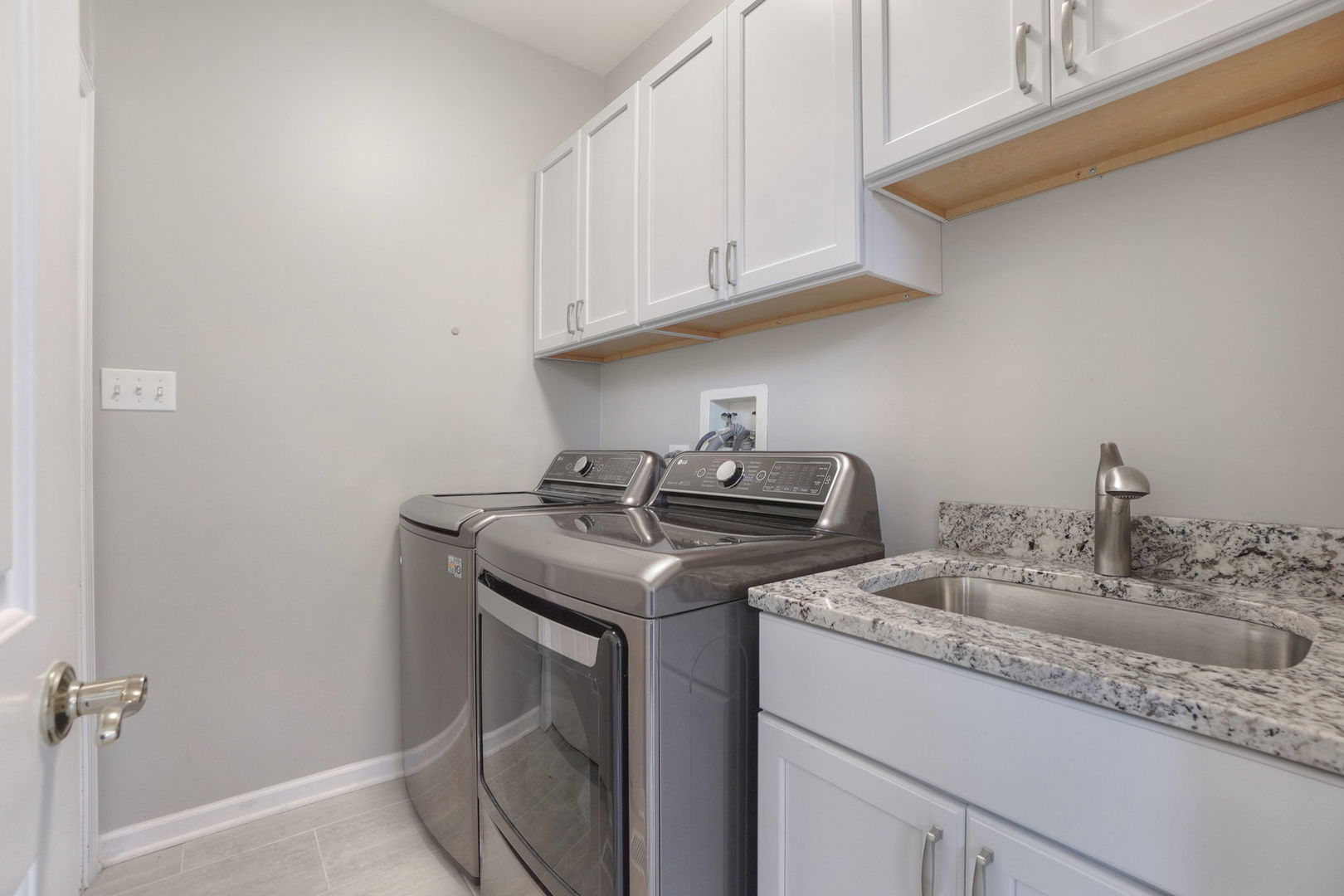 4775 Snapjack Circle Naperville, IL 60564 - Photo 25 of 55 a kitchen with granite countertop a sink a stove and cabinets