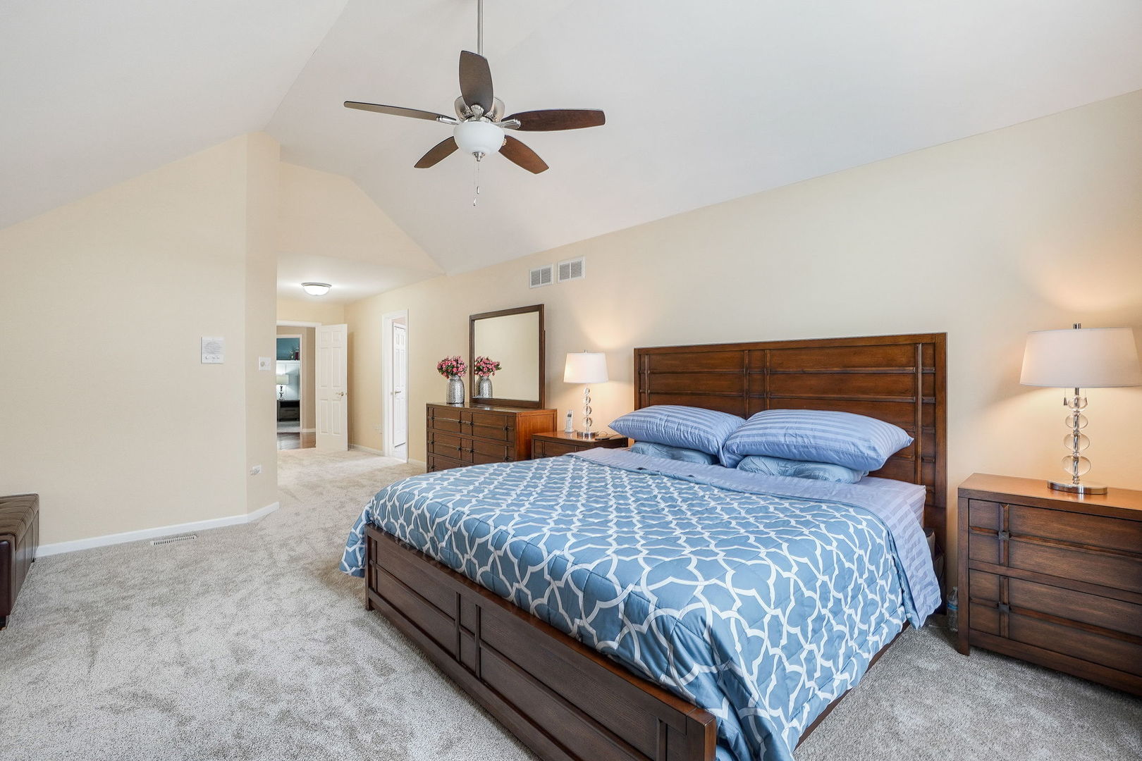 4775 Snapjack Circle Naperville, IL 60564 - Photo 29 of 55 a bedroom with a bed a ceiling fan and a dresser