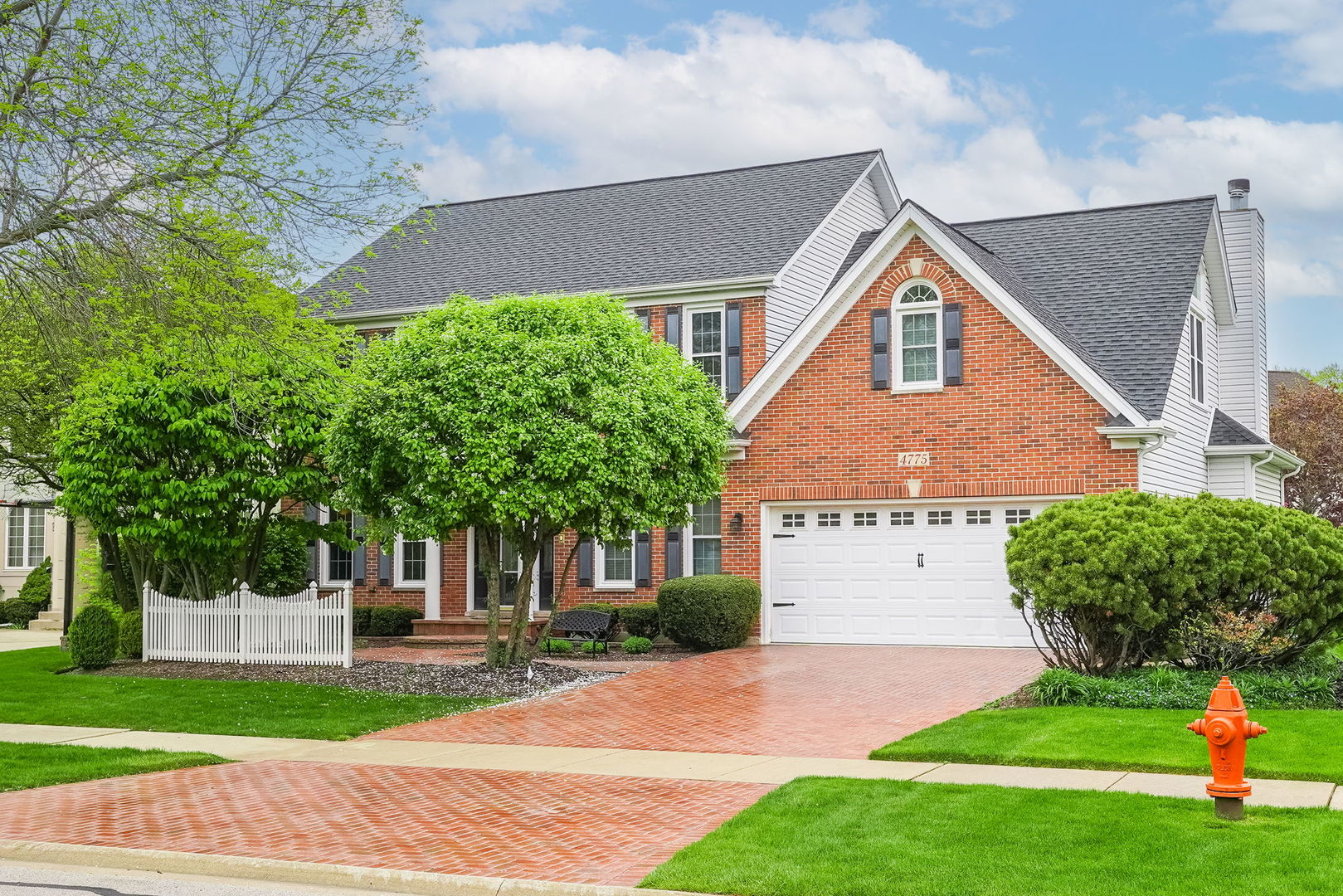4775 Snapjack Circle Naperville, IL 60564 - Photo 4 of 55 a front view of a house with a yard and garage