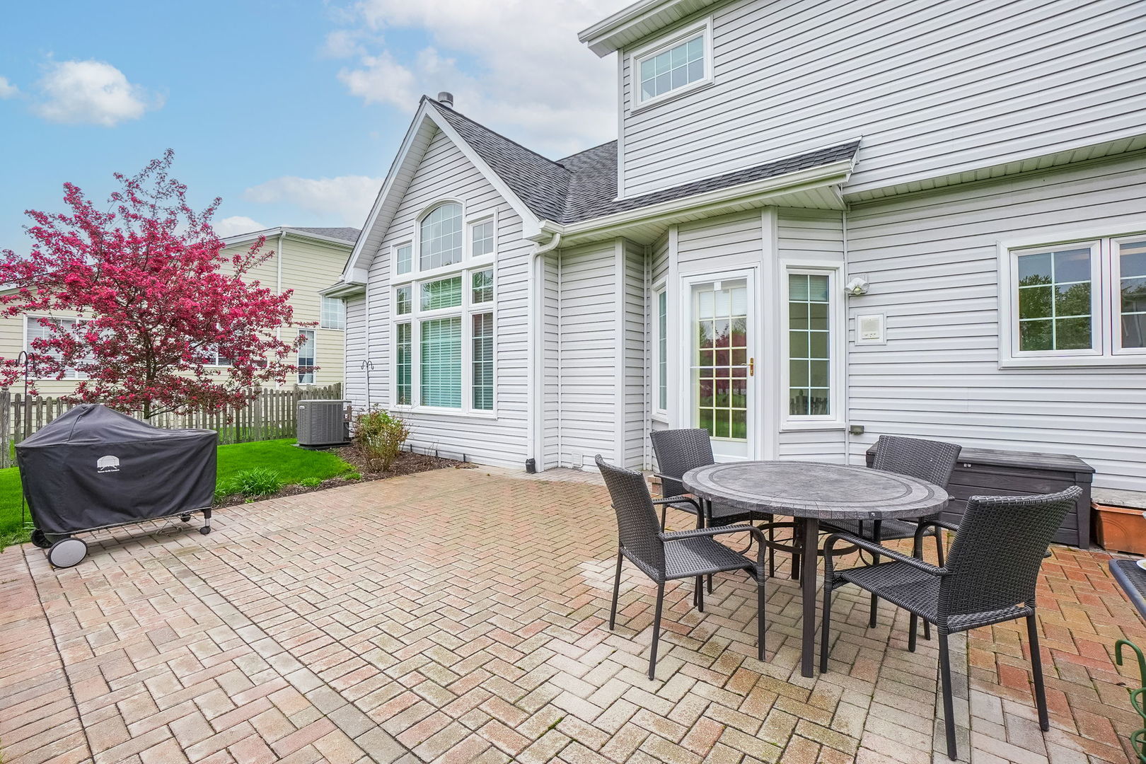 4775 Snapjack Circle Naperville, IL 60564 - Photo 47 of 55 a view of a house with a table and chair in the patio