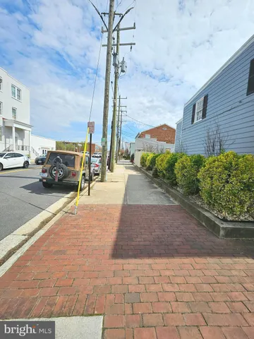 a view of street with parked cars