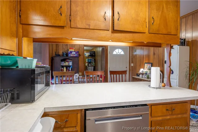 a view of a kitchen with furniture