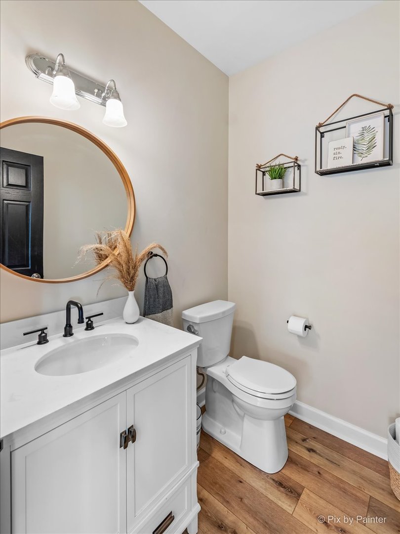985 Kendall Street Elburn, IL 60119 - Photo 17 of 32 a bathroom with a toilet sink and mirror