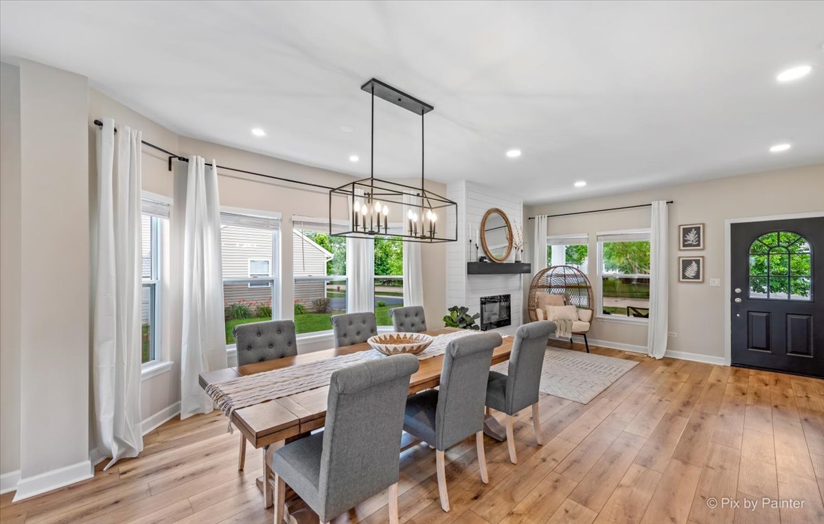 985 Kendall Street Elburn, IL 60119 - Photo 23 of 32 a view of a dining room with furniture window and wooden floor