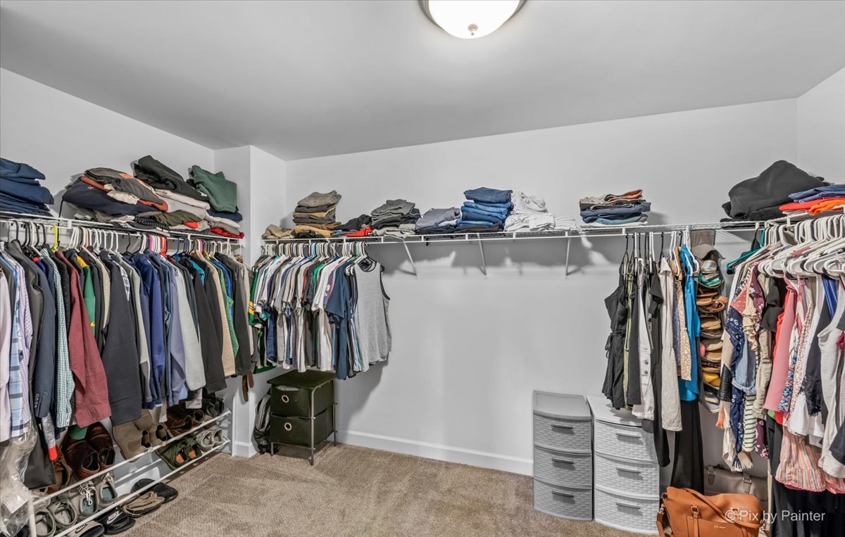 985 Kendall Street Elburn, IL 60119 - Photo 26 of 32 a view of walk in closet with clothes