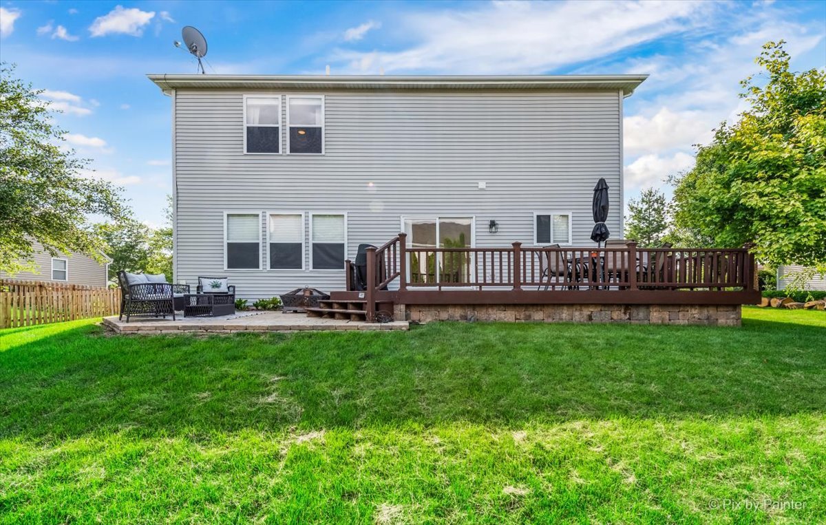 985 Kendall Street Elburn, IL 60119 - Photo 32 of 32 a view of a house with a yard and deck