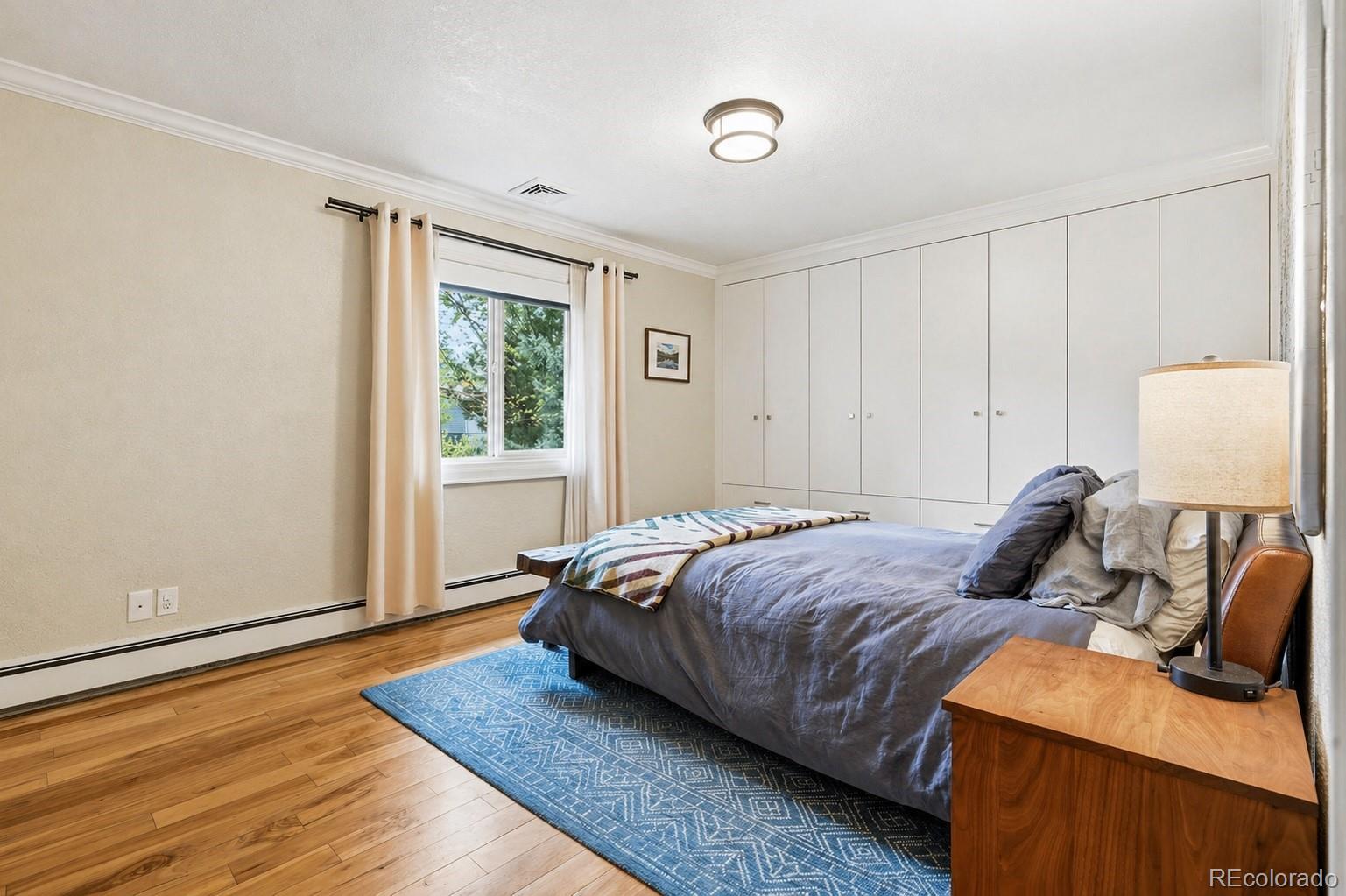 3393 Simms Street Wheat Ridge, CO 80033 - Photo 15 of 42 a bedroom with bed and window