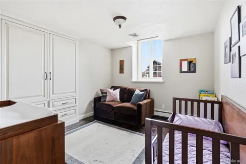a bedroom with furniture and a window