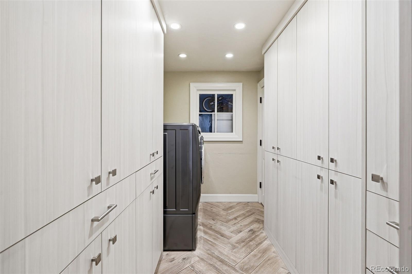 3393 Simms Street Wheat Ridge, CO 80033 - Photo 32 of 42 a view of a hallway with closet