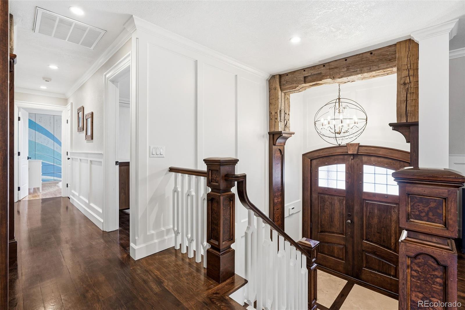 3393 Simms Street Wheat Ridge, CO 80033 - Photo 5 of 42 a view of a hallway with wooden floor and entryway