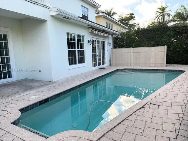 a view of a backyard with sitting area