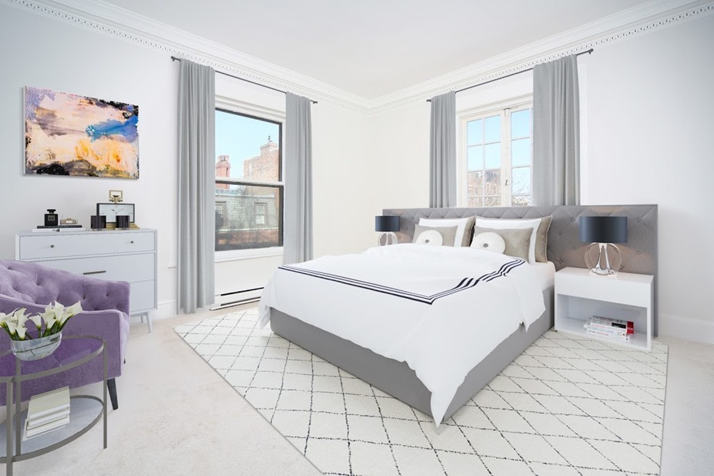 333 Commonwealth Avenue, Unit 16 Boston, MA 02115 - Photo 2 of 5 a bedroom with a bed and a painting on the wall