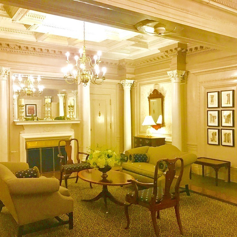 333 Commonwealth Avenue, Unit 16 Boston, MA 02115 - Photo 4 of 5 a living room with patio furniture and a chandelier