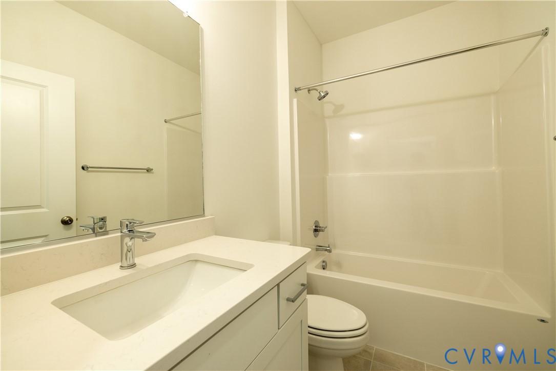 15309 Sunray Alley Chesterfield, VA 23832 - Photo 12 of 50 a bathroom with a sink a toilet and shower