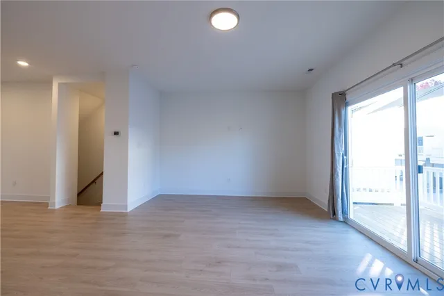 a view of an empty room and window