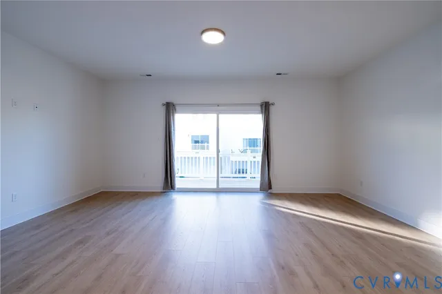 a view of a kitchen with wooden floor