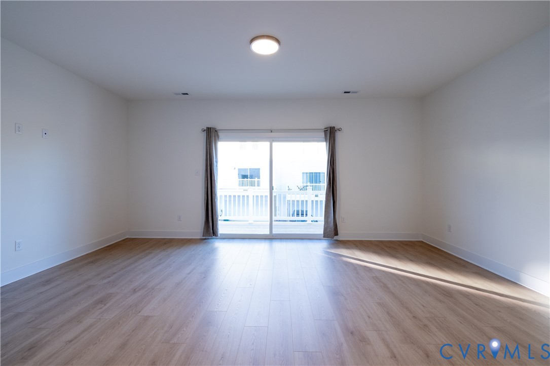15309 Sunray Alley Chesterfield, VA 23832 - Photo 22 of 50 an empty room with wooden floor and windows