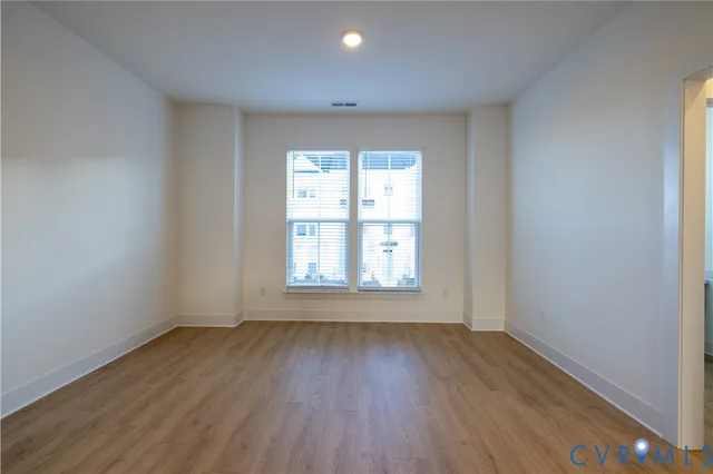 a kitchen with stainless steel appliances a stove a refrigerator a sink a microwave and cabinets