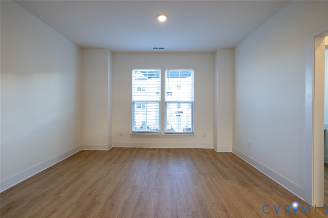 15309 Sunray Alley Chesterfield, VA 23832 - Photo 26 of 50 an empty room with wooden floor and windows