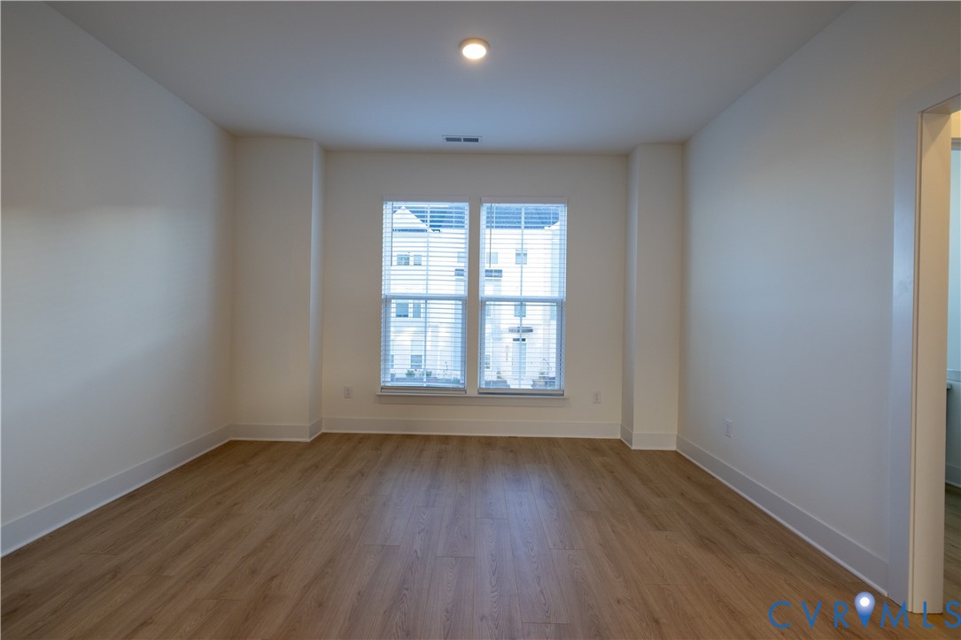 15309 Sunray Alley Chesterfield, VA 23832 - Photo 27 of 50 an empty room with wooden floor and windows