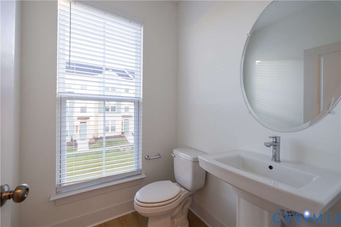 15309 Sunray Alley Chesterfield, VA 23832 - Photo 31 of 50 a white toilet sitting next to a bathroom sink