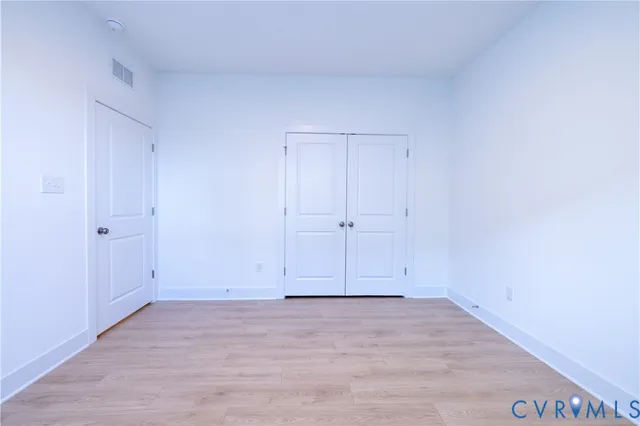 a view of room with hardwood floor