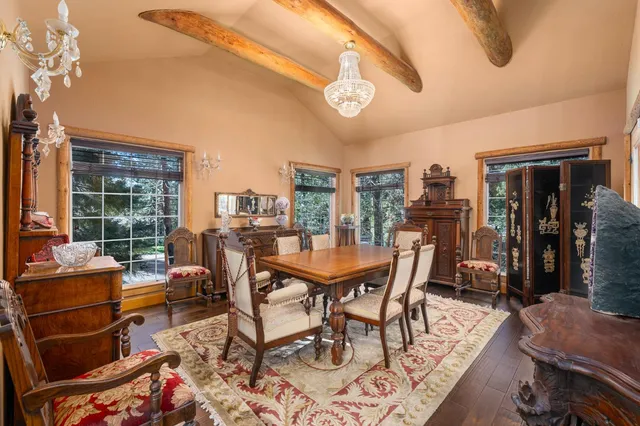 a view of house with a large window and wooden floor