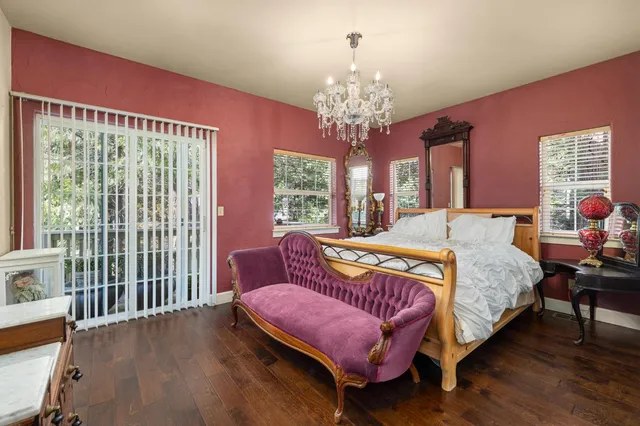 a living room with a couch and a potted plant