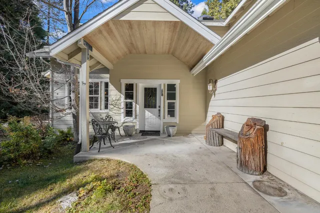 a view of an entryway with wooden floor and stairs