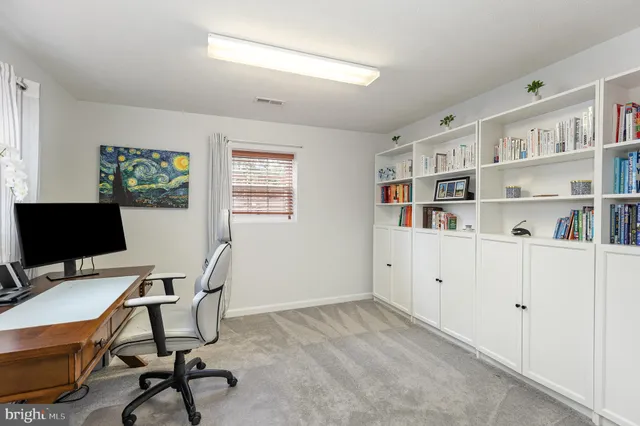 a view of a workspace with furniture