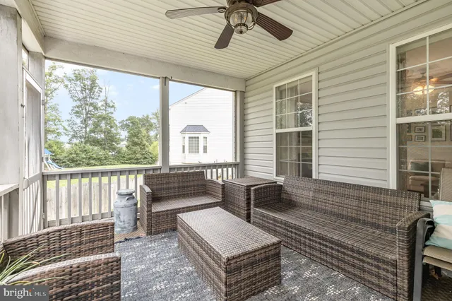 a living room with furniture and windows