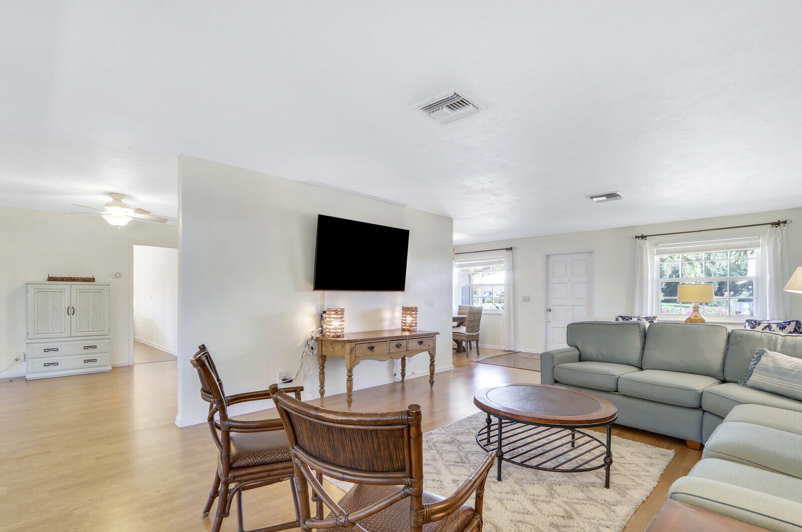 8574 Southeast Seagrape Way Hobe Sound, FL 33455 - Photo 11 of 38 a living room with furniture and a flat screen tv