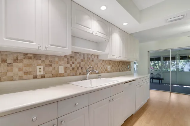 a kitchen with a sink and cabinets