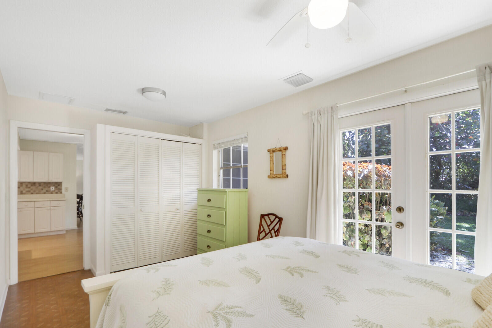 8574 Southeast Seagrape Way Hobe Sound, FL 33455 - Photo 20 of 38 a bedroom with a bed and a window