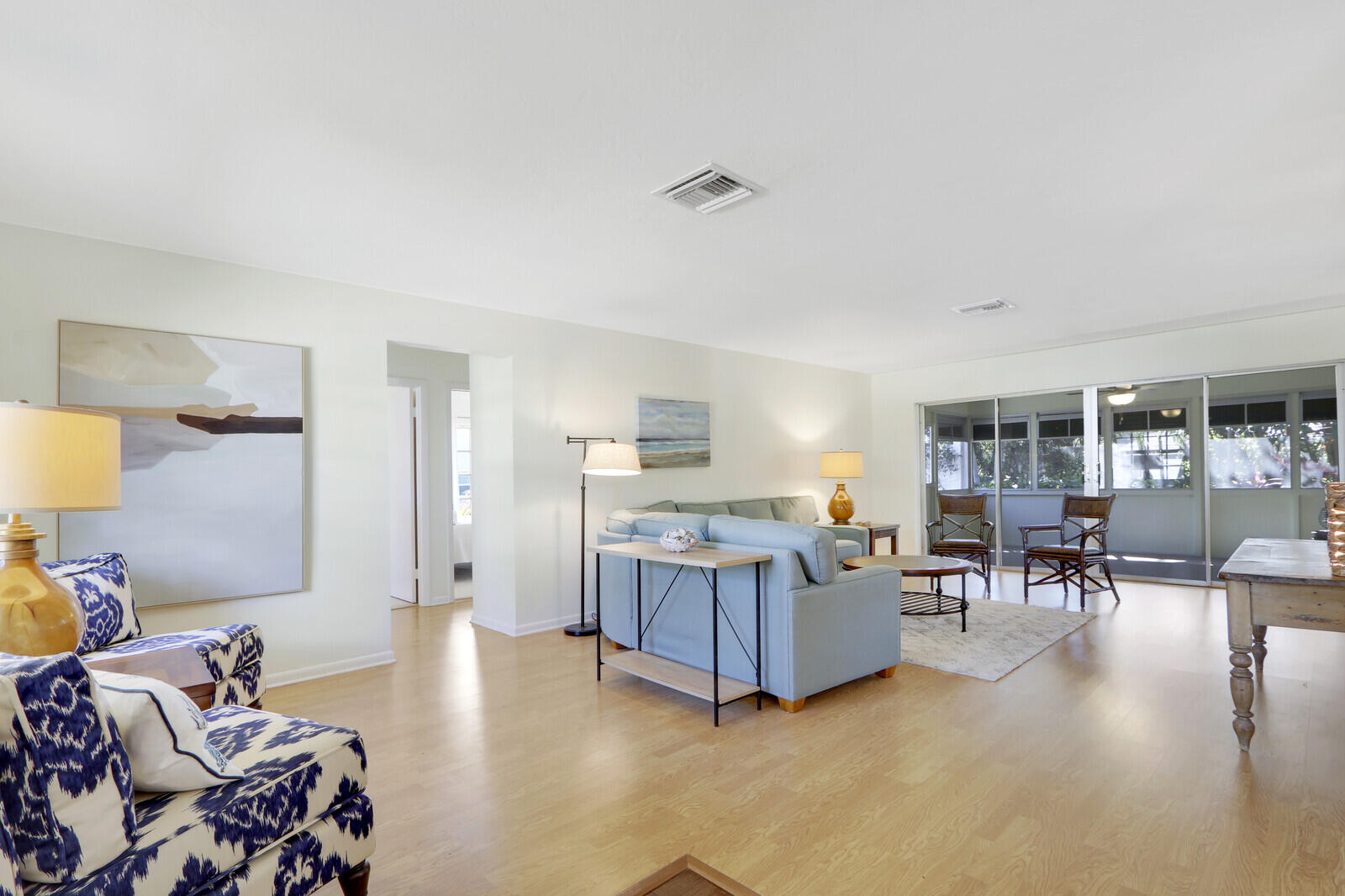 8574 Southeast Seagrape Way Hobe Sound, FL 33455 - Photo 6 of 38 a living room with furniture and a wooden floor