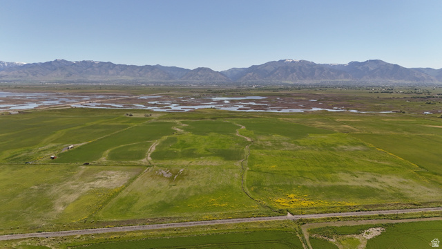 320 South 5400 West Logan, UT 84321 - Photo 31 of 42 Expansive open fields with varied green vegetation