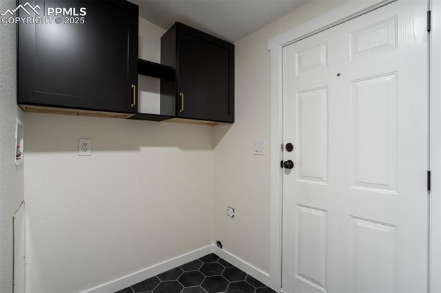 5455 Prospero Road Peyton, CO 80831 - Photo 23 of 47 The laundry room walks out to the deck. Also has plenty of room to add a freezer or mud bench