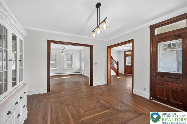 a view of a kitchen with a sink dishwasher and a large window