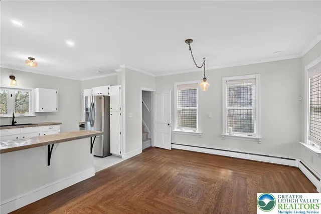 a view of kitchen with wooden floor