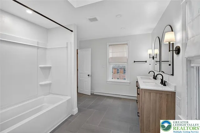 a view of an empty room with a window