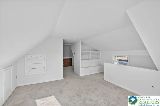 a view of a hallway with staircase