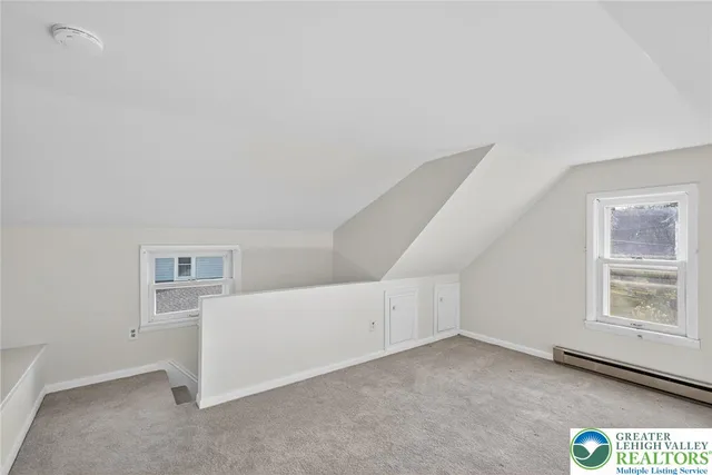 a view of a hallway with a room