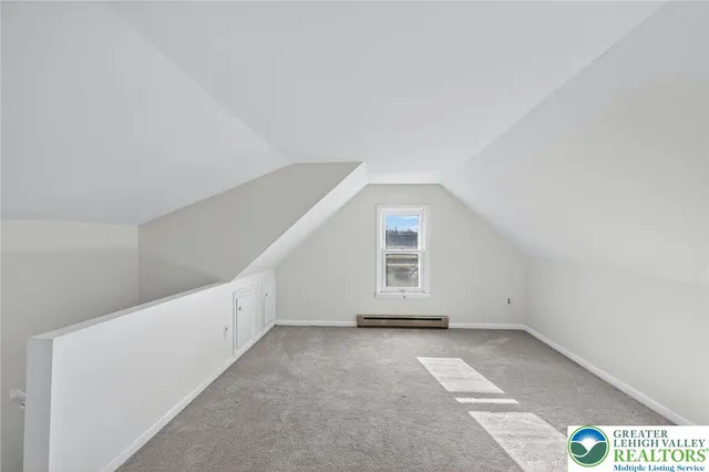 a view of an empty room with windows