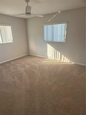 a view of a house with a backyard and a yard
