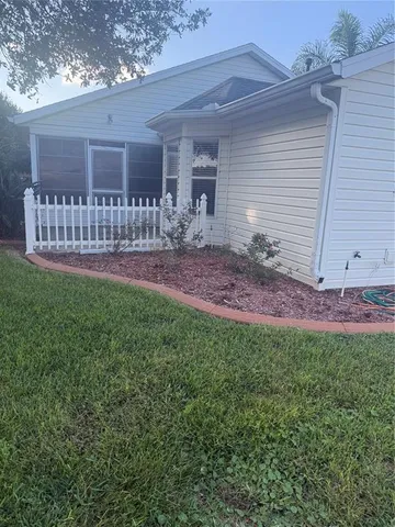 a view of a backyard with a garden