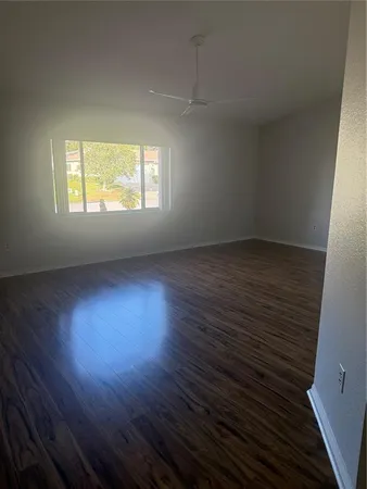 a kitchen with stainless steel appliances a sink cabinets and window
