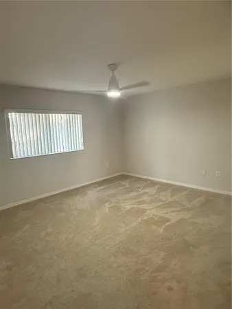 en empty room with windows and stairs