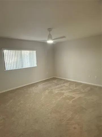 en empty room with windows and stairs