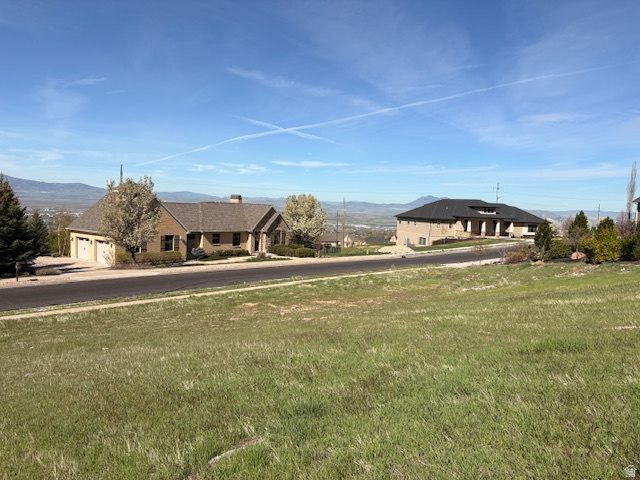 2970 Mahogony Valley Road, Unit 6 Logan, UT 84341 - Photo 8 of 9 View of front of house with a front lawn and a mountain view